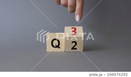 From 2nd Quarter to 3rd symbol. Businessman hand points at turned wooden cube with words 2nd Quarter and 3rd Quarter. Beautiful grey background. Business and Quarter concept. Copy space From 2nd Quarter to 3rd symbol. Businessman hand points at turned wooden cube with words 2nd Quarter and 3rd Quarter. Beautiful grey background. Business and Quarter concept. Copy space 100074203