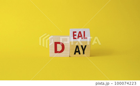 Deal of the Day symbol. Turned cube with words Deal of the Day. Beautiful yellow background. Business and Deal of the Day concept. Copy space Deal of the Day symbol. Turned cube with words Deal of the Day. Beautiful yellow background. Business and Deal of the Day concept. Copy space 100074223