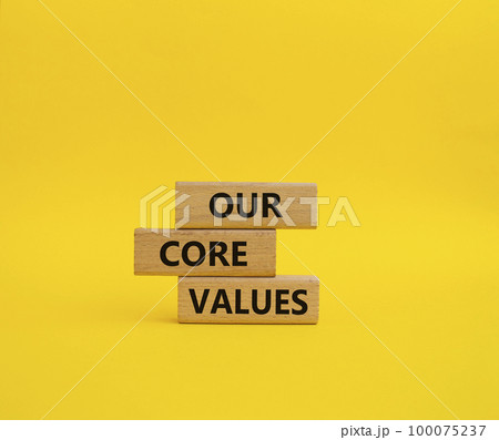 Our core values symbol. Concept words 'Our core values' on wooden blocks. Beautiful yellow background. Business and Our core values concept. Copy space. Our core values symbol. Concept words 'Our core values' on wooden blocks. Beautiful yellow background. Business and Our core values concept. Copy space. 100075237