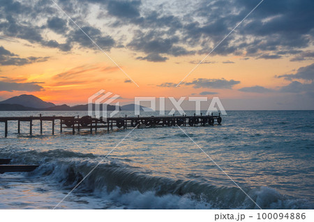 Wooden pier in sea at sunrise. Koktebel. Crimea 100094886