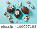 Easter composition with chocolate and gold eggs 100097198