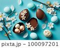 Easter composition with chocolate eggs and cherry branches 100097201