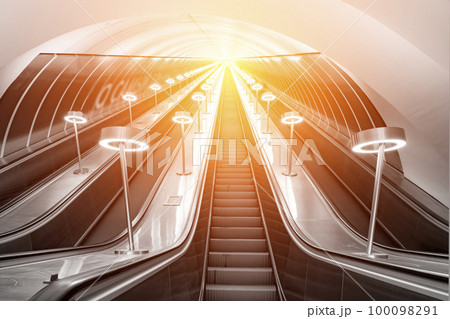 climbing the escalator, concept upward movement climbing the escalator, concept upward movement 100098291