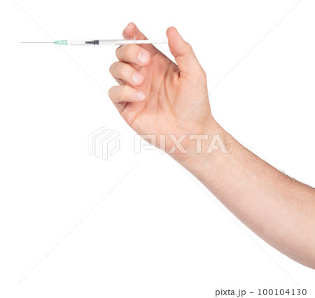New syringe in adult hand on white background 100104130