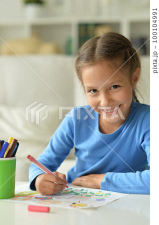 Cute little preschooler child drawing at home Cute little preschooler child drawing at home 100104991
