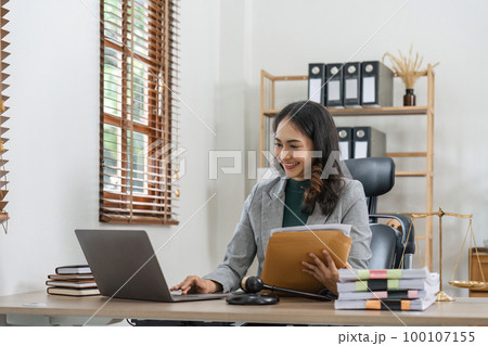 Beautiful asian woman lawyer working and gavel, tablet, laptop in front, Advice justice and law concept Beautiful asian woman lawyer working and gavel, tablet, laptop in front, Advice justice and law concept 100107155