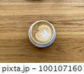 Latte art on wooden table 100107160