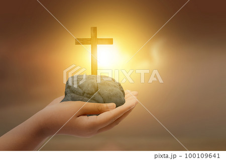 Human hand showing Christian cross 100109641
