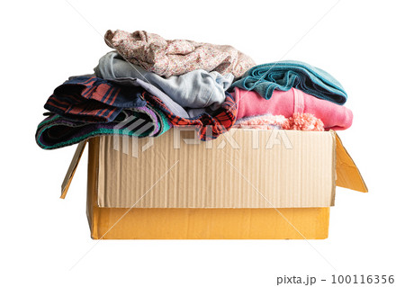 Donation box with used clothes isolated on white background with clipping path to support help for poor people in the world. 100116356