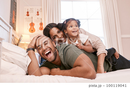 Theres no better bond than a family bond. Shot of a young family relaxing at home. 100119041