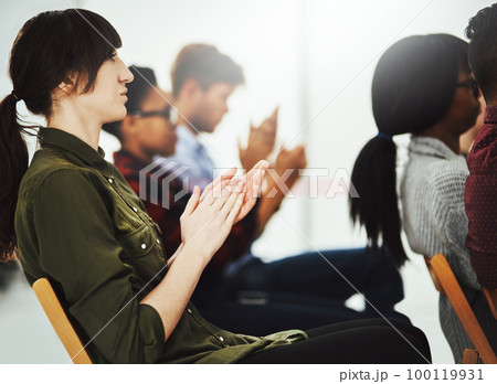 Lets give it a round of applause. Shot of a group of businesspeople clapping their hands during a presentation in a conference room. Lets give it a round of applause. Shot of a group of businesspeople clapping their hands during a presentation in a conference room. 100119931