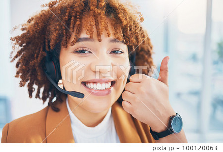 Woman, smile portrait and thumbs up in call center for customer service, support or crm. Black person consultant, receptionist or agent for telemarketing, contact us or help desk success hand sign 100120063