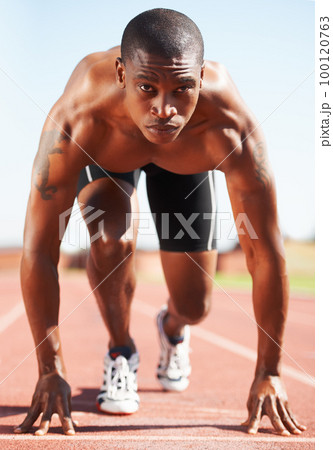 On your mark. A runner at the starting line. 100120763