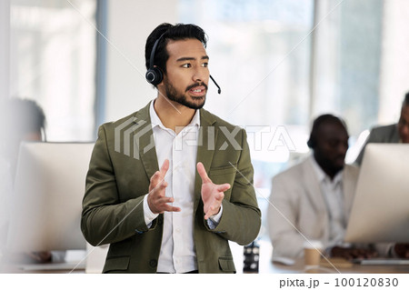 Call center, serious and consulting with man in office for customer support, telemarketing and advisory. Help desk, team leader and contact us with employee listening for communication, sales and crm Call center, serious and consulting with man in office for customer support, telemarketing and advisory. Help desk, team leader and contact us with employee listening for communication, sales and crm 100120830