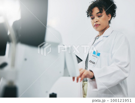 Healthcare, machine and black woman in laboratory, check experiment and wellness with focus. Medical professional, African American female employee or researcher with lab equipment, testing or typing Healthcare, machine and black woman in laboratory, check experiment and wellness with focus. Medical professional, African American female employee or researcher with lab equipment, testing or typing 100121951