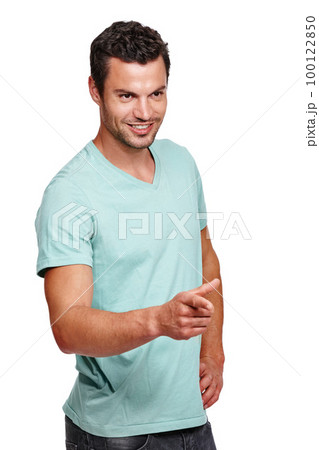 Handsome man, smile and pointing finger while standing against a white studio background. Isolated attractive happy male model posing and smiling while showing direction on a white background Handsome man, smile and pointing finger while standing against a white studio background. Isolated attractive happy male model posing and smiling while showing direction on a white background 100122850