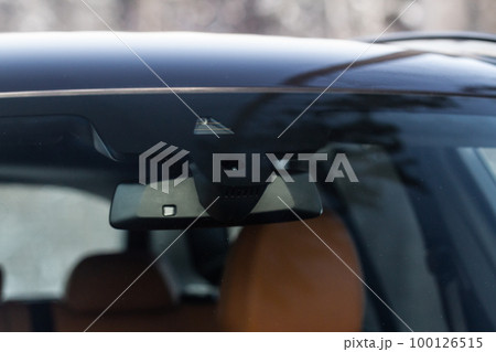Windshield rain and light sensors of modern car. Car rain sensor. Windshield rain and light sensors of modern car. Car rain sensor. 100126515