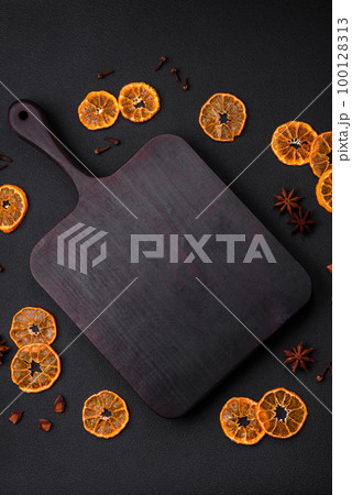 Dried round shape slices of bright orange color tangerine Dried round shape slices of bright orange color tangerine 100128313