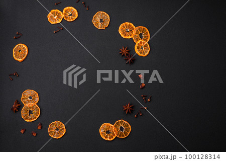 Dried round shape slices of bright orange color tangerine Dried round shape slices of bright orange color tangerine 100128314