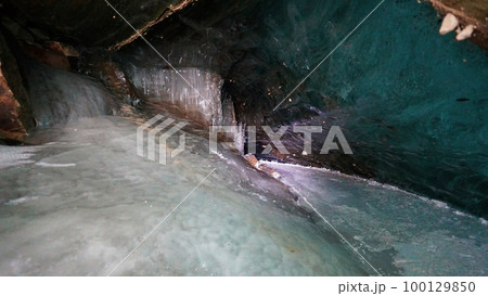 Turquoise pure color of ice inside the ice cave. Turquoise pure color of ice inside the ice cave. 100129850