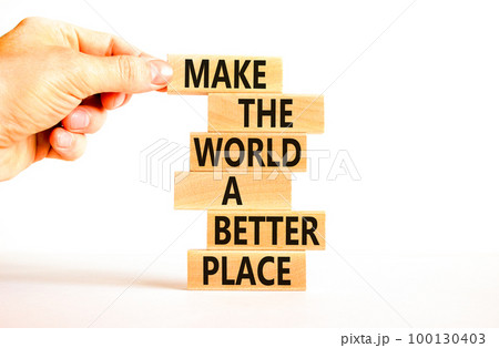 Make a better world symbol. Concept words Make the world a better place on wooden blocks. Beautiful white table white background. Businessman hand. Business make a better world concept. Copy space. Make a better world symbol. Concept words Make the world a better place on wooden blocks. Beautiful white table white background. Businessman hand. Business make a better world concept. Copy space. 100130403