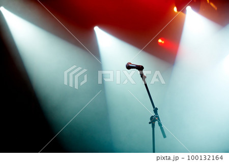 Ready for the concert. A microphone stand on an empty stage. Ready for the concert. A microphone stand on an empty stage. 100132164