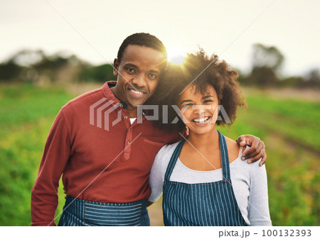 Our farm is thriving. Cropped portrait of an affectionate young couple standing on their farm. 100132393