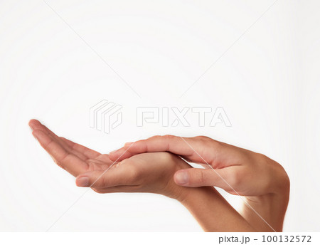 Beauty from fingertip to fingertip. Closeup studio shot of a womans hands. 100132572