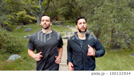 Running, fitness and people in nature forest for training, outdoor wellness or challenge with focus, motivation and energy. Sports men friends, personal trainer athlete exercise together in mountain 100132934