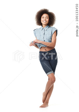 Looking cute and feeling a sense of fun. Cute young african american woman standing isolated on white. 100133450