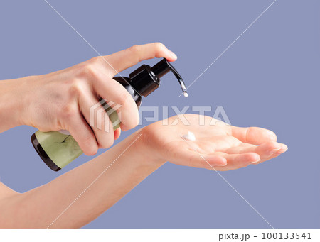 Moisturizer, skincare and hands with a bottle for cream isolated on a blue background in studio. Beauty, cosmetic and woman with lotion or sunscreen in palm for moisture, treatment and grooming Moisturizer, skincare and hands with a bottle for cream isolated on a blue background in studio. Beauty, cosmetic and woman with lotion or sunscreen in palm for moisture, treatment and grooming 100133541