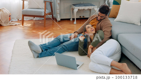 Love, laptop and relax diversity couple enjoy quality time together, house peace and bonding in home living room. Online shopping, happy woman and calm man in communication discussion about choice 100133718