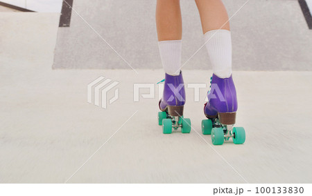 Park, hobby and legs of a woman rollerskating for fitness, training and sport on the ground. Exercise, practice and feet of a girl doing cardio to skate for urban sports, learning and activity Park, hobby and legs of a woman rollerskating for fitness, training and sport on the ground. Exercise, practice and feet of a girl doing cardio to skate for urban sports, learning and activity 100133830