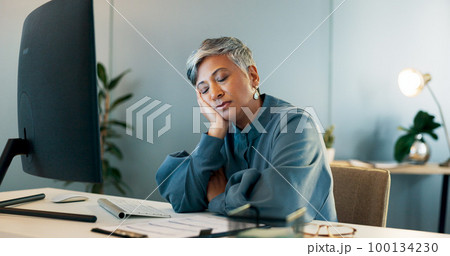 Tired, burnout and mature business woman with a computer for administration, report writing and finance management. Bored, sad and employee thinking of admin stress, email and depressed at desk job Tired, burnout and mature business woman with a computer for administration, report writing and finance management. Bored, sad and employee thinking of admin stress, email and depressed at desk job 100134230