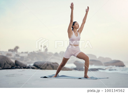Yoga pose, woman and posture at beach for wellness, peace and zen, balance and ocean background. Fitness, girl and meditation, training and energy outdoor for peaceful, mindset and stretch workout 100134562
