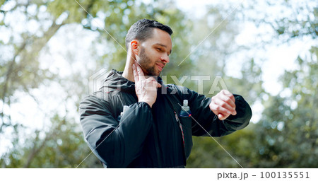 Man checking pulse in neck, smartwatch with fitness app and hiking on adventure trail in forest. Nature, workout and exercise for healthy athlete in woods with 5g, heart rate tracker and motivation. 100135551