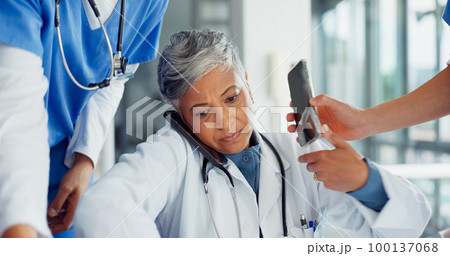 Busy, phone call and doctor with medical paperwork, health communication and help from nurse team at a hospital. Chaos, stress and healthcare consultant with anxiety from working medicine at a clinic Busy, phone call and doctor with medical paperwork, health communication and help from nurse team at a hospital. Chaos, stress and healthcare consultant with anxiety from working medicine at a clinic 100137068