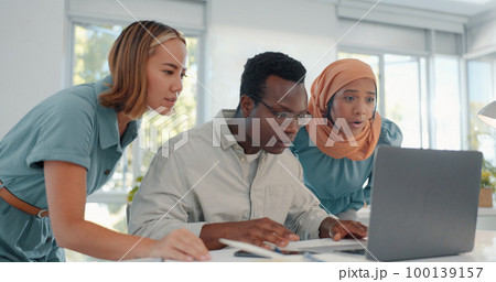 Laptop, good news and team in celebration of success, achievement or teamwork goal in the office. Diversity, celebrate and happy business people celebrating successful collaboration in the workplace. 100139157