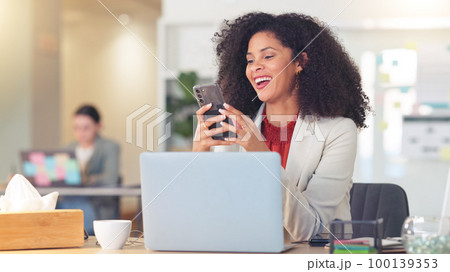 Real estate agent typing on laptop, thinking of creative property marketing advertisement to post on social media to sell a property. Confident, ambitious realtor with afro negotiating deal via email 100139353