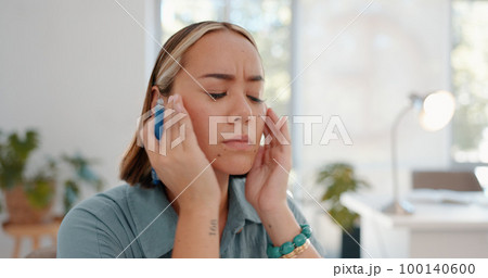 Headache, pain and burnout business woman overworked and thinking in her office feeling stress or depressed. Sad, mental health and female worker or employee feeling unhappy and frustrated 100140600