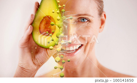 Face, skincare and senior woman with avocado in studio isolated on a gray background. Portrait, cosmetics overlay and happy female model with fruit for nutrition, vitamin c or healthy diet for beauty Face, skincare and senior woman with avocado in studio isolated on a gray background. Portrait, cosmetics overlay and happy female model with fruit for nutrition, vitamin c or healthy diet for beauty 100141650