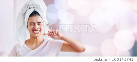 Toothbrush, woman and cleaning teeth on banner, bokeh background and mockup space of dental wellness. Happy girl brush mouth for mint breath, cosmetics and beauty of skincare, shower and mock up face 100141743