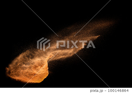 Brown sand explosion isolated on black background. Freeze motion of sandy dust splash. Brown sand explosion isolated on black background. Freeze motion of sandy dust splash. 100146864