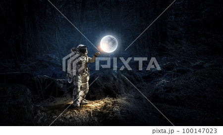Astronaut walking on an unexplored planet Astronaut walking on an unexplored planet 100147023