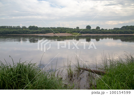 Image of the river from coast in cloudy day Image of the river from coast in cloudy day 100154599
