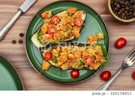Yummy vegetarian food, stuffed eggplant 100158952