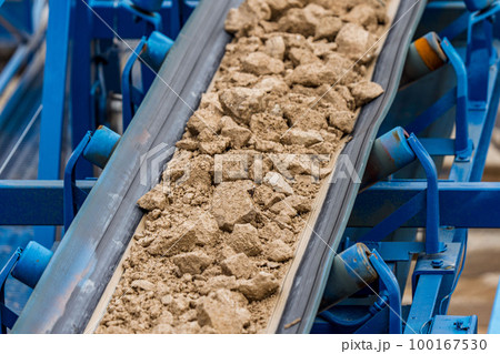 Industrial belt conveyor moving raw materials from mine 100167530