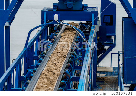 Industrial belt conveyor moving raw materials from mine Industrial belt conveyor moving raw materials from mine 100167531