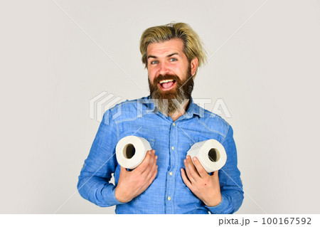 Ready for any event. toilet paper shortage in coronavirus panic. fear of pandemic outbreak closing shopping stores. man hold tissue in toilet. bearded man hold toilet paper. guy suffer from diarrhea 100167592