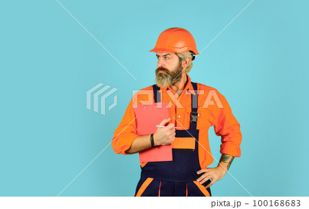 Buy materials for renovation. Bearded storekeeper. Checklist. Inspecting. Control concept. Foreman with document. Delivering building materials. Man in hard hat holding clipboard looking information 100168683